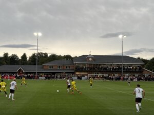 Darlington defender Scott Barrow with advancing play at the middle of the park at the Blackwell Meadows ground.